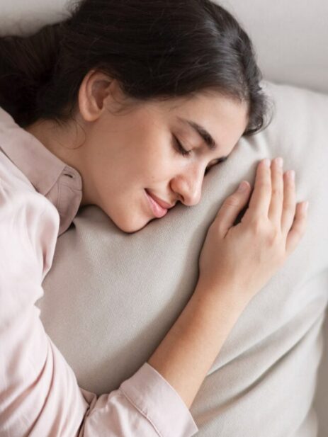 woman-sleeping-comfortably-her-pillow-min